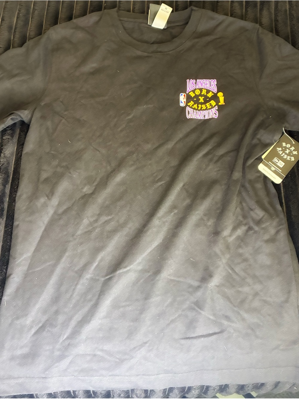 New Era Black Short Sleeve Tee with Small Colorful Los Angeles Champions Graphic